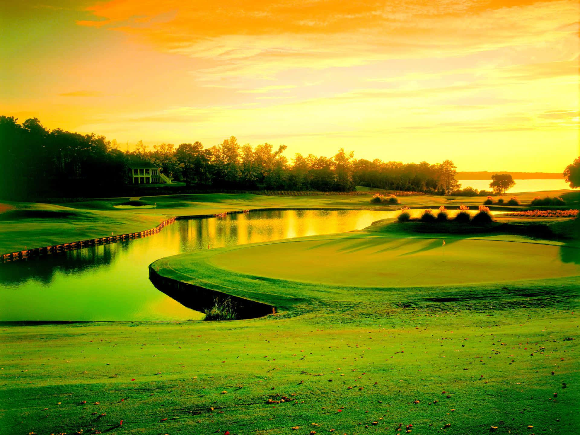 Electrifying View Of A Golf Course At Sunset Background