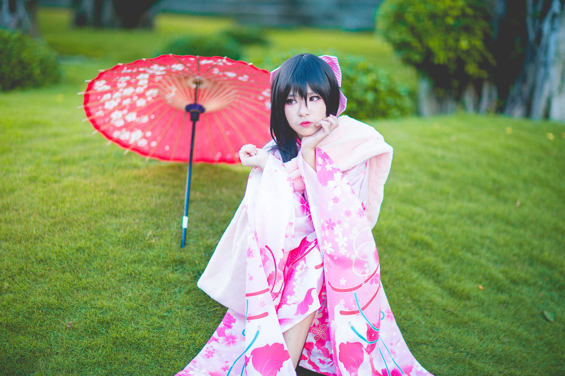 Elegance Embodied - Japanese Girl In Pink Kimono Background