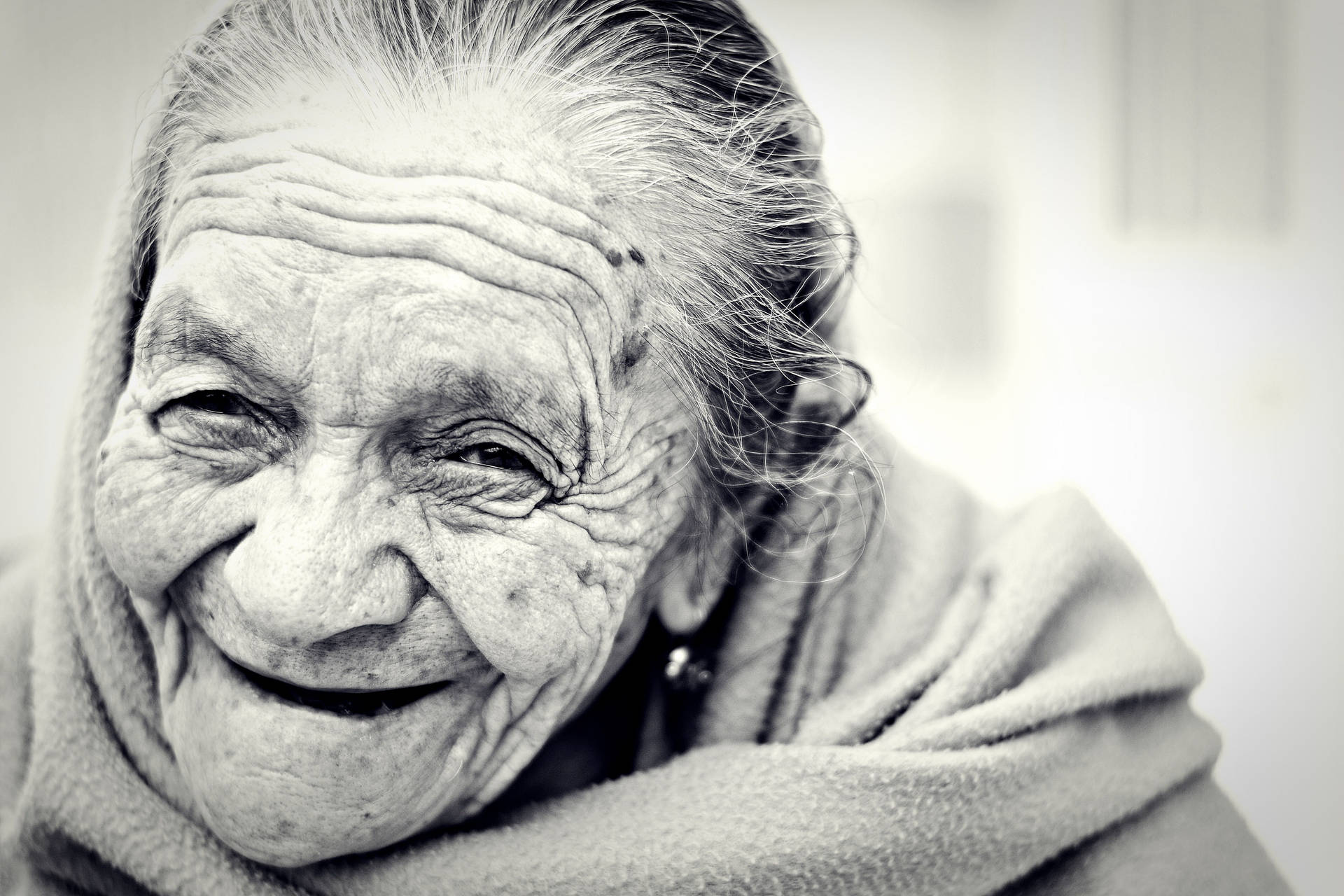 Elegant Aging Gracefully - A Monochrome Portrait Of A Beautiful Older Woman Background