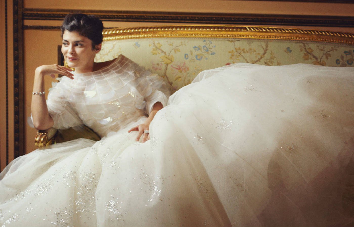 Elegant Audrey Tautou In White Dress Background