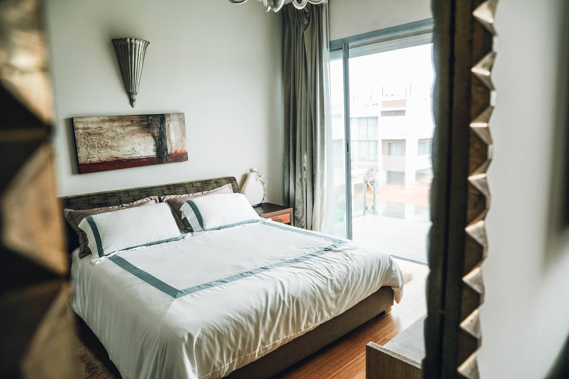 Elegant Bedroom With Stylish Mirror Background