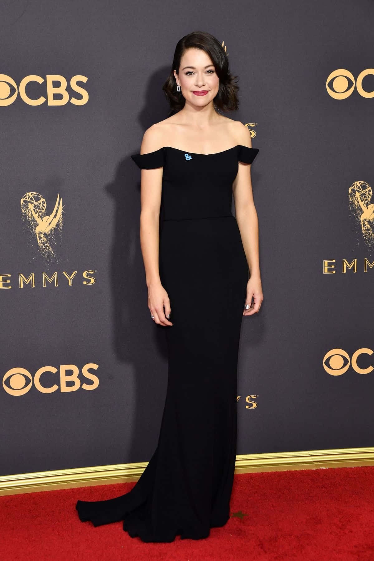 Elegant Black Dress Emmys Red Carpet Background