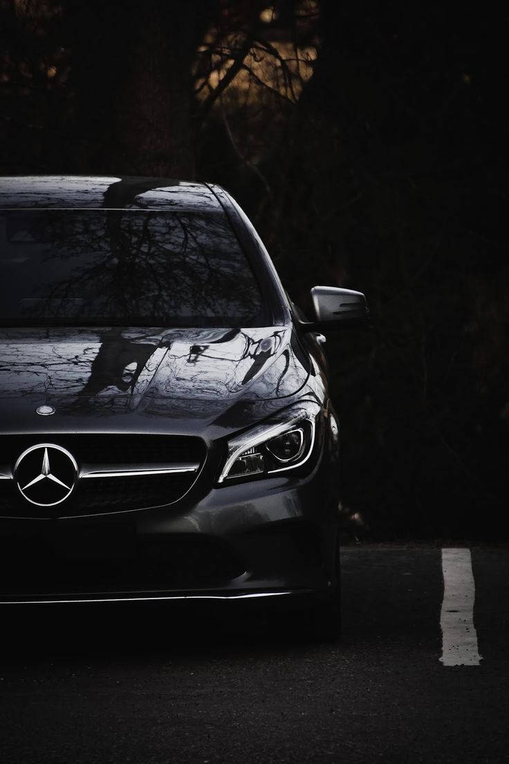 Elegant Black Mercedes-benz In Profile Background