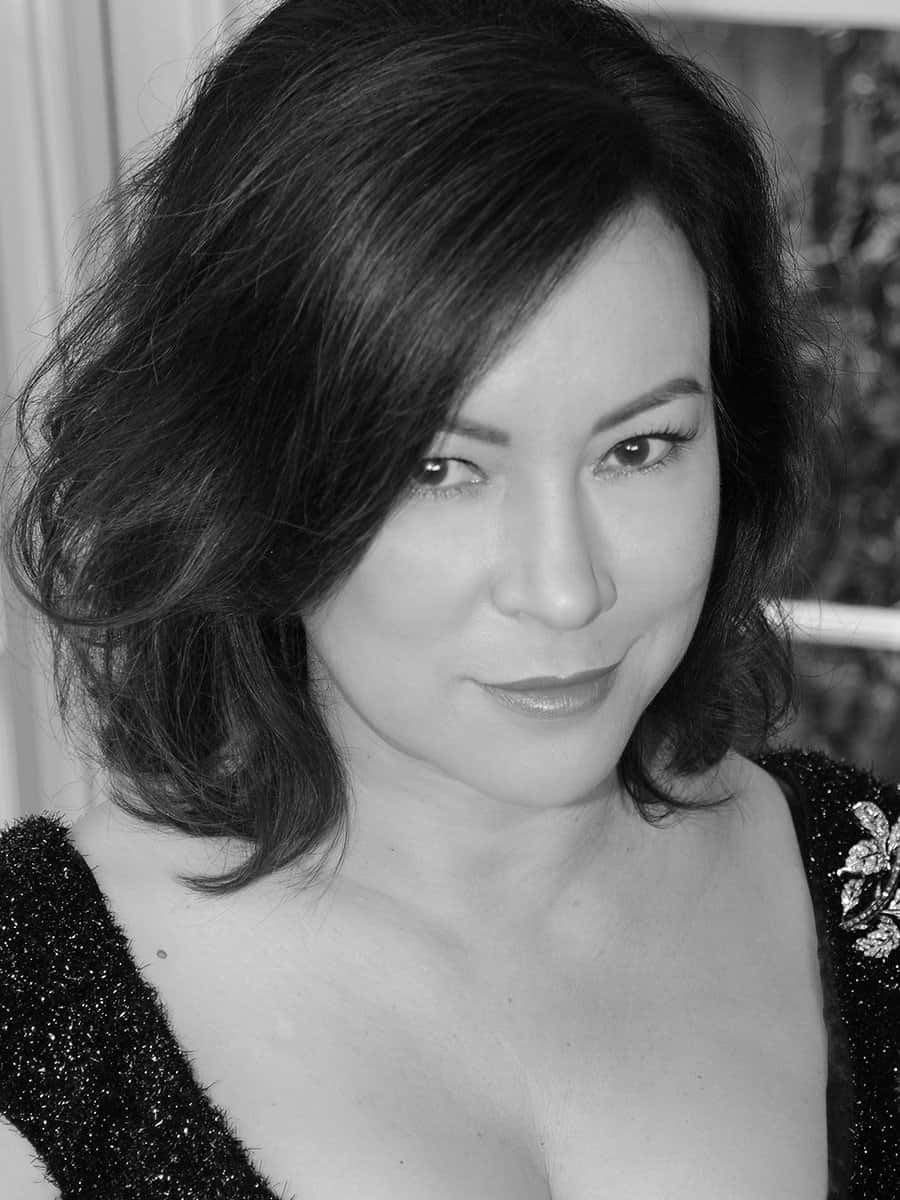 Elegant Blackand White Portraitof Jennifer Tilly Background