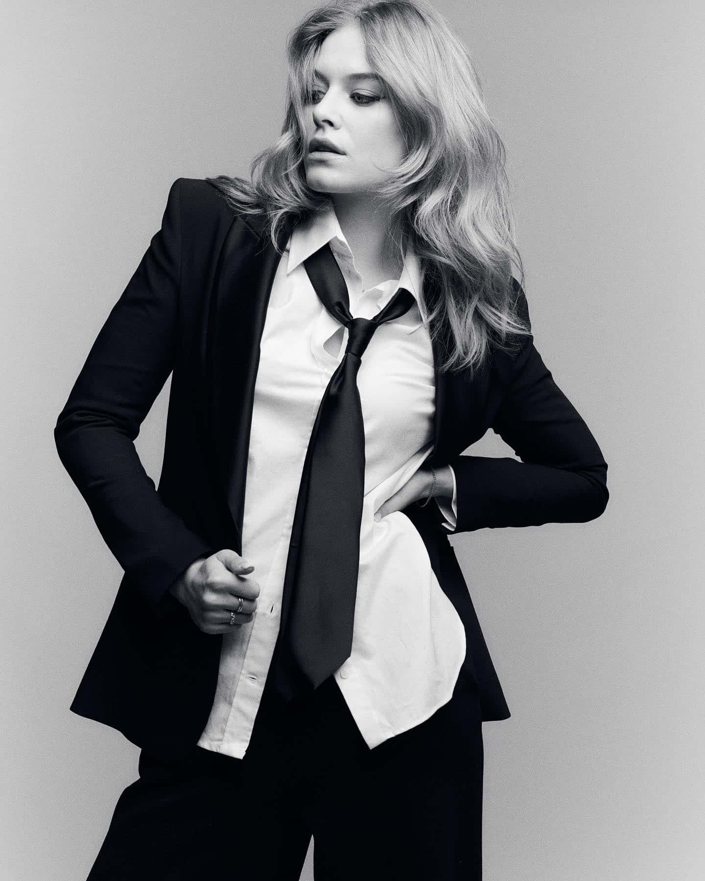 Elegant Blackand White Portraitof Womanin Suit