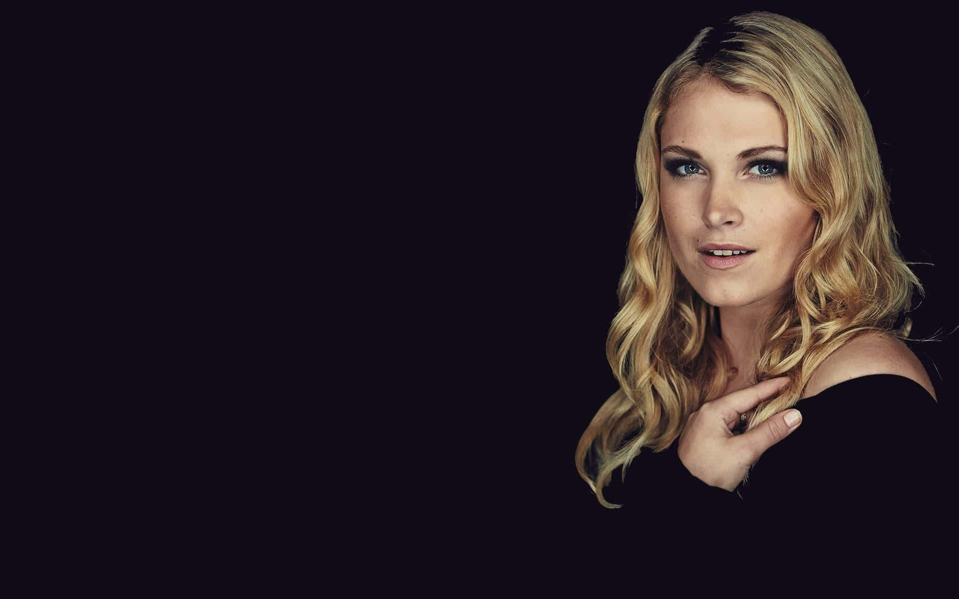 Elegant Blonde Woman Black Background