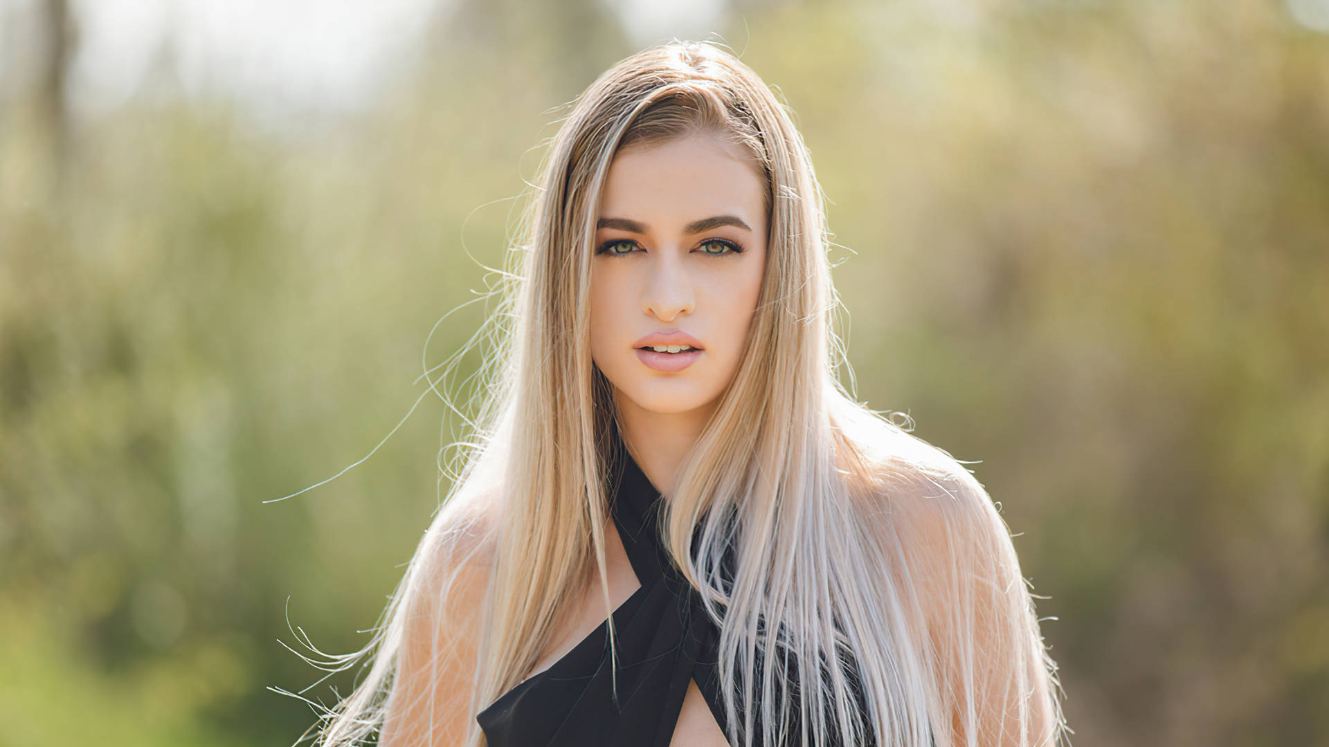 Elegant Blonde Woman In Stylish Black Dress Background