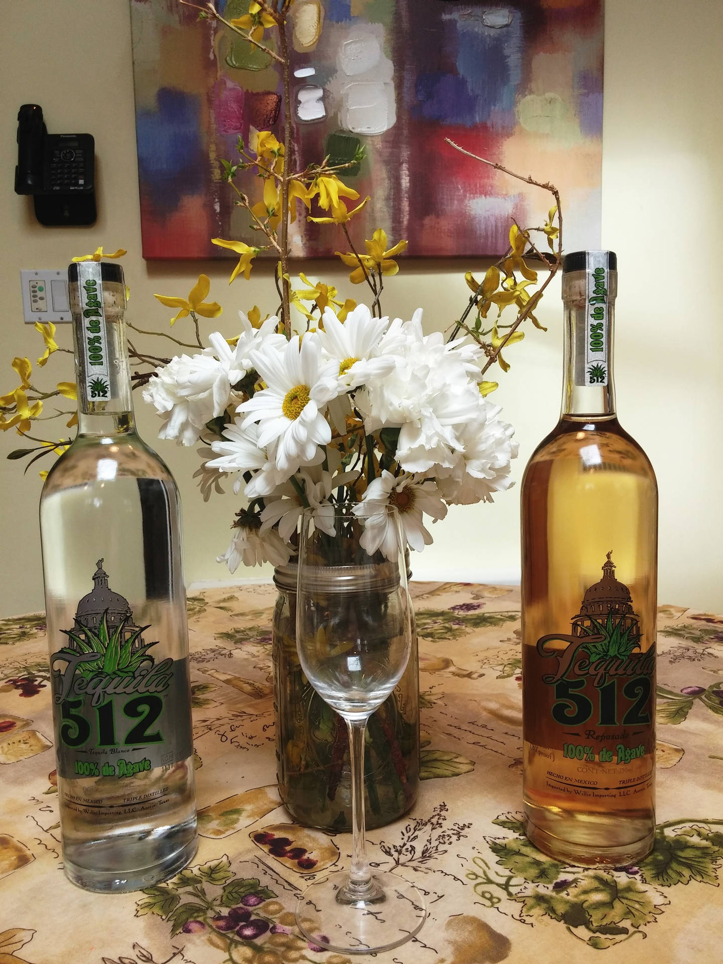 Elegant Bottle Of Tequila 512 With Distinctive Grey And Yellow Label