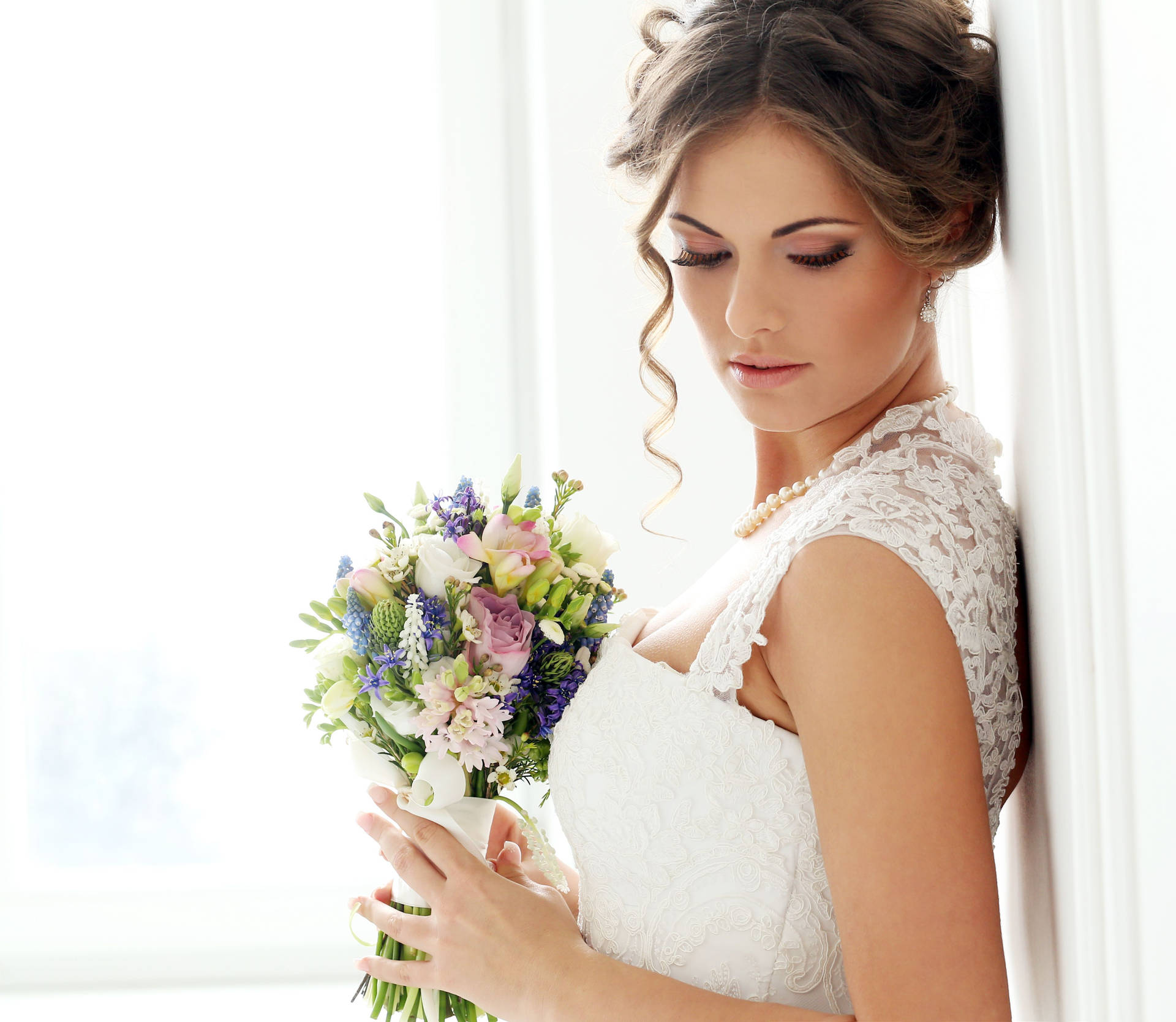 Elegant Bride In A Detailed Wedding Gown Background