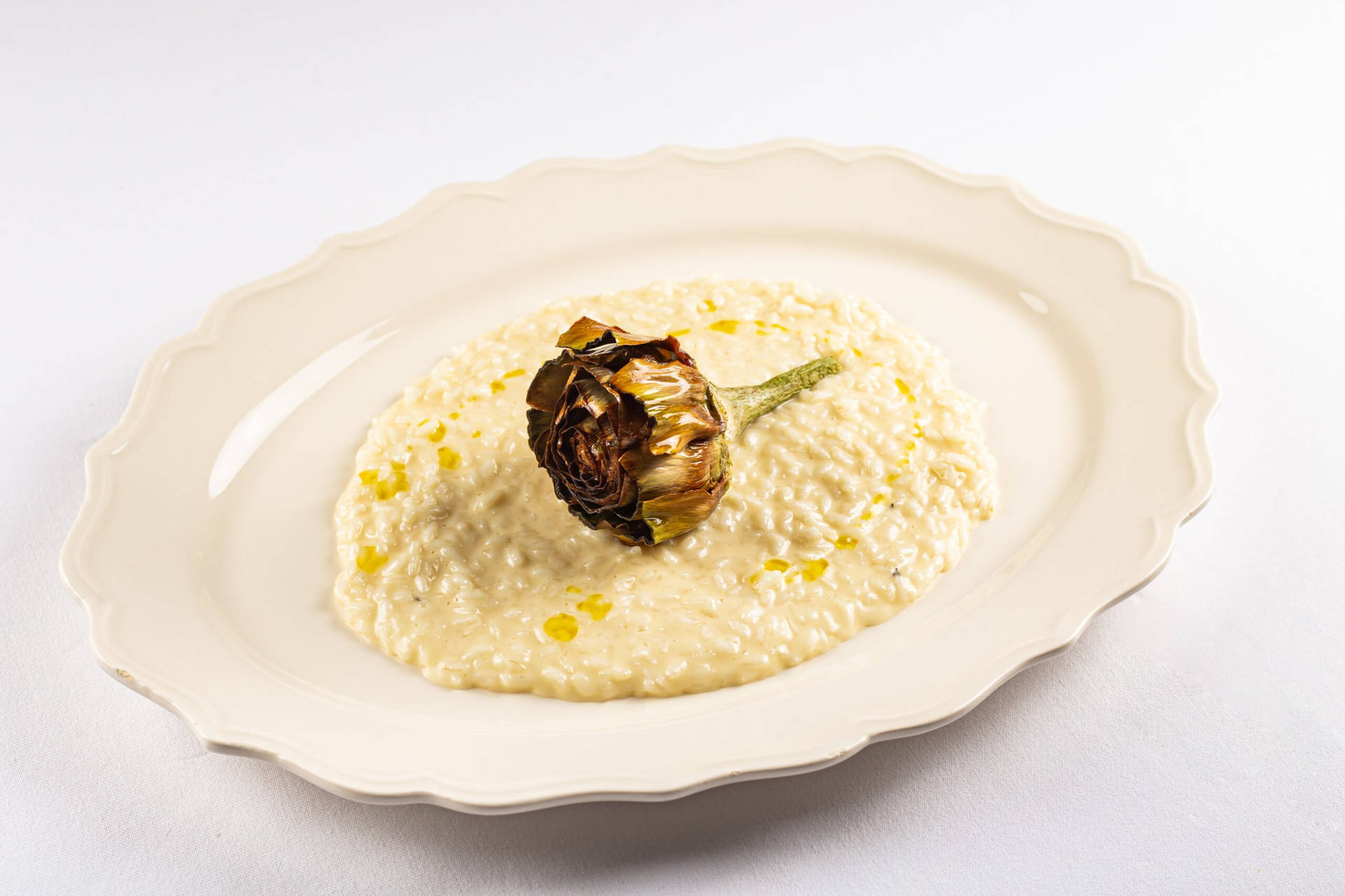 Elegant Gourmet Risotto With Dried Rose Garnish Background