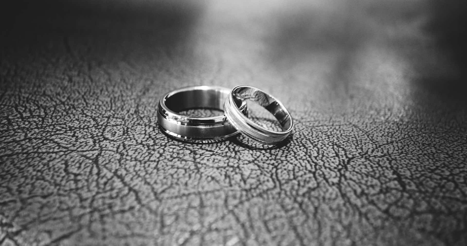 Elegant Greyscale Wedding Ring On Fine Leather Background