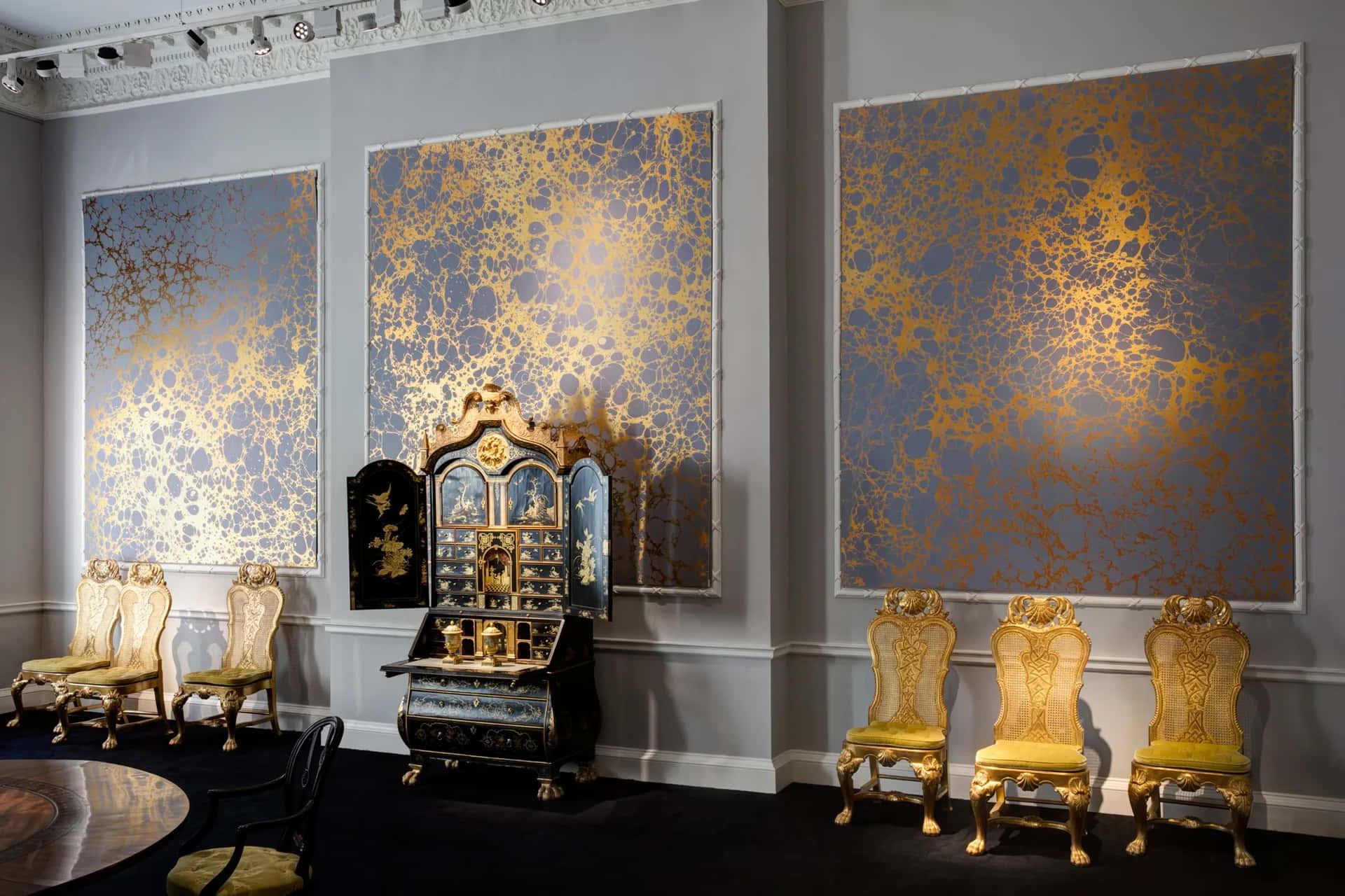 Elegant Interiorwith Golden Artwork Background