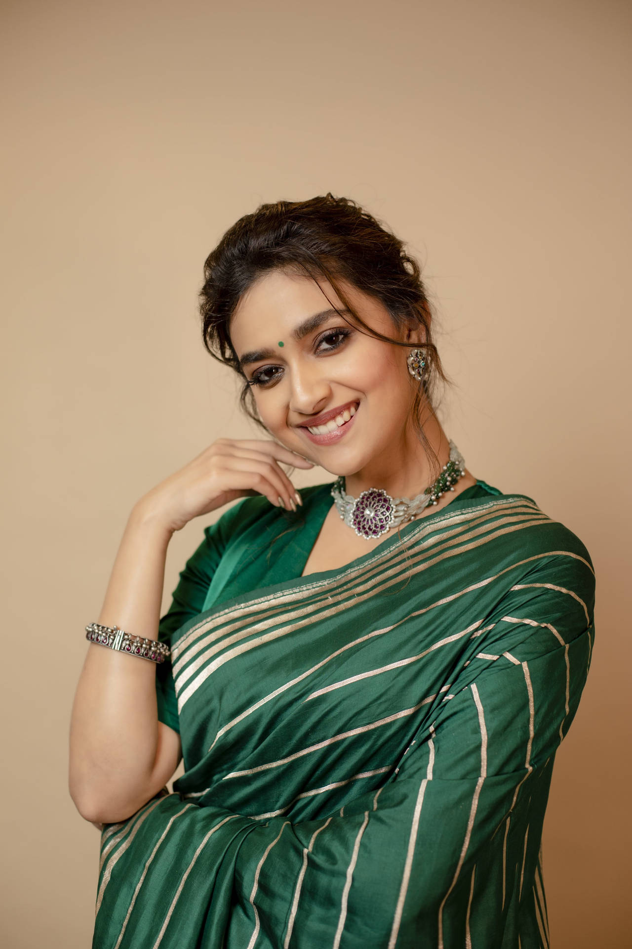 Elegant Keerthi Suresh In A Traditional Green Saree Background