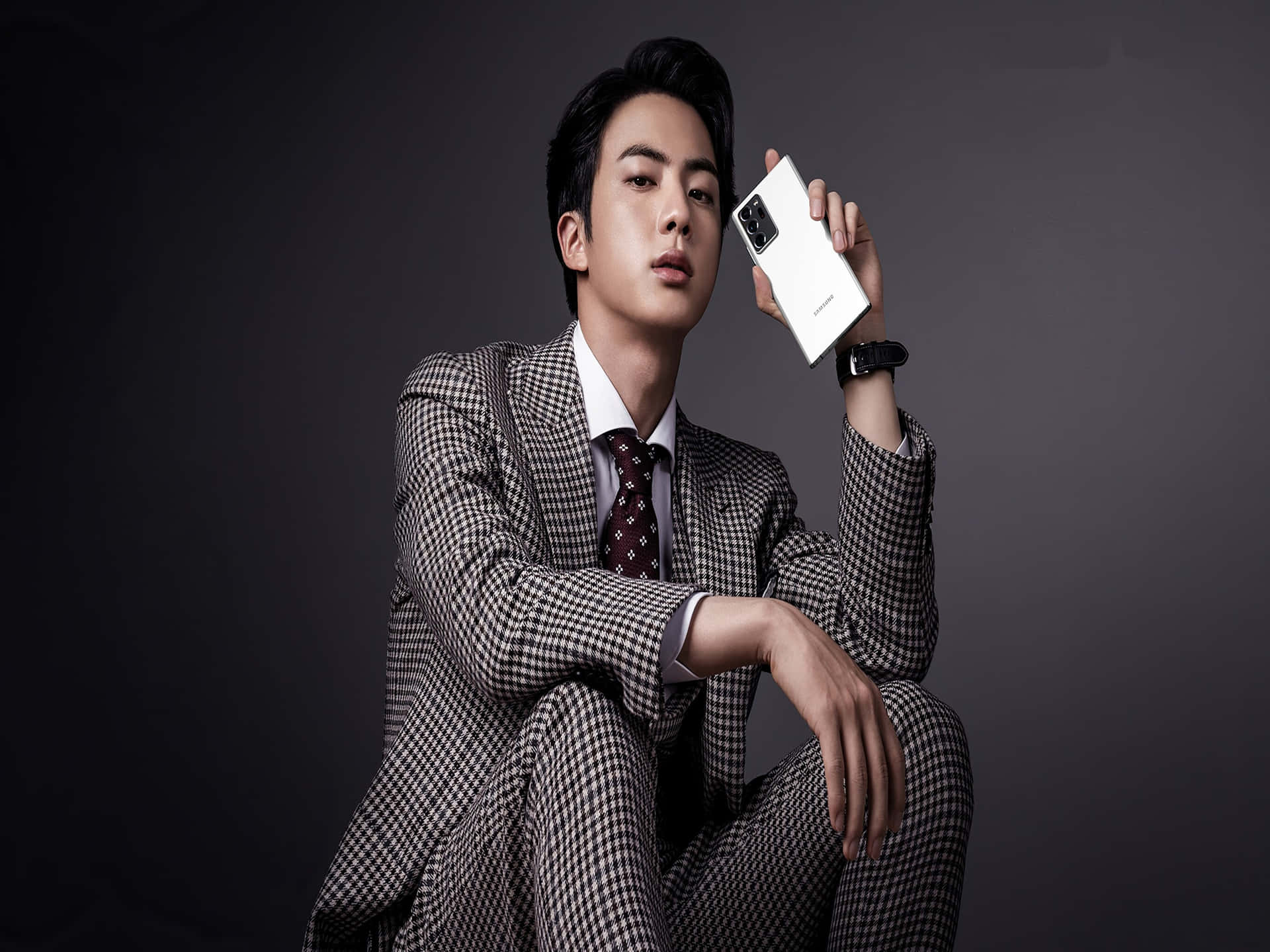 Elegant Man Holding Smartphone