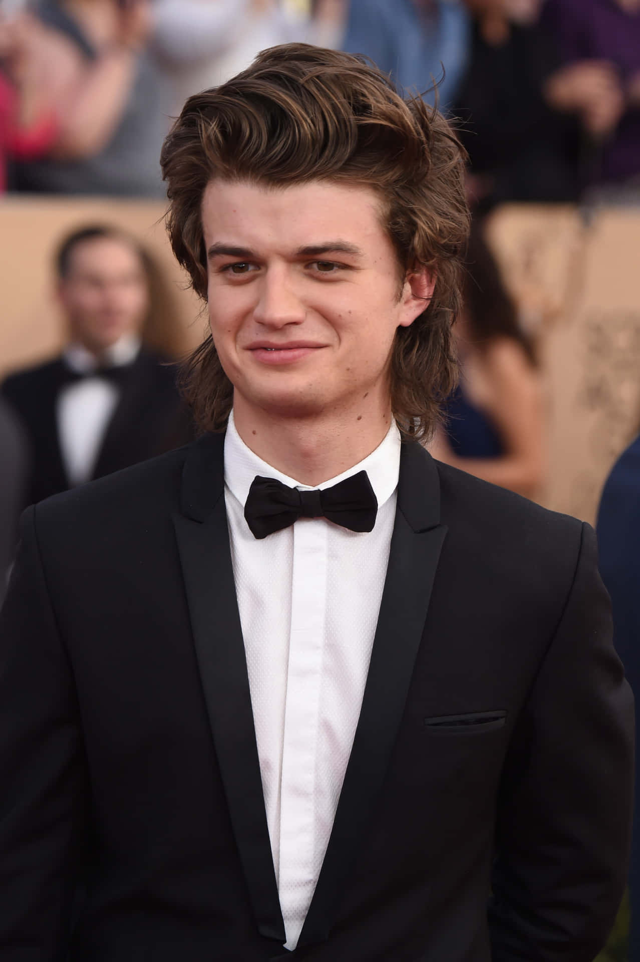 Elegant Manin Black Tuxedoat Event Background