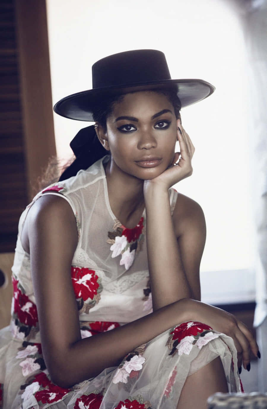 Elegant Modelin Floral Dressand Hat Background