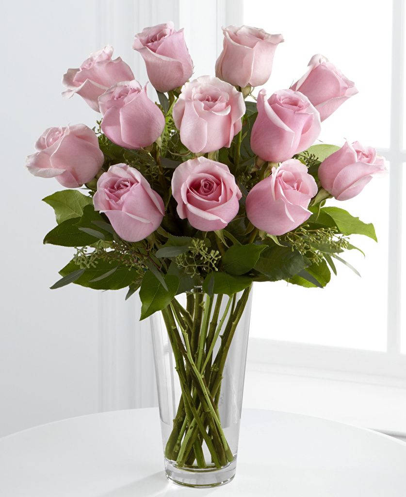 Elegant Pink Roses In A Crystal Vase Background