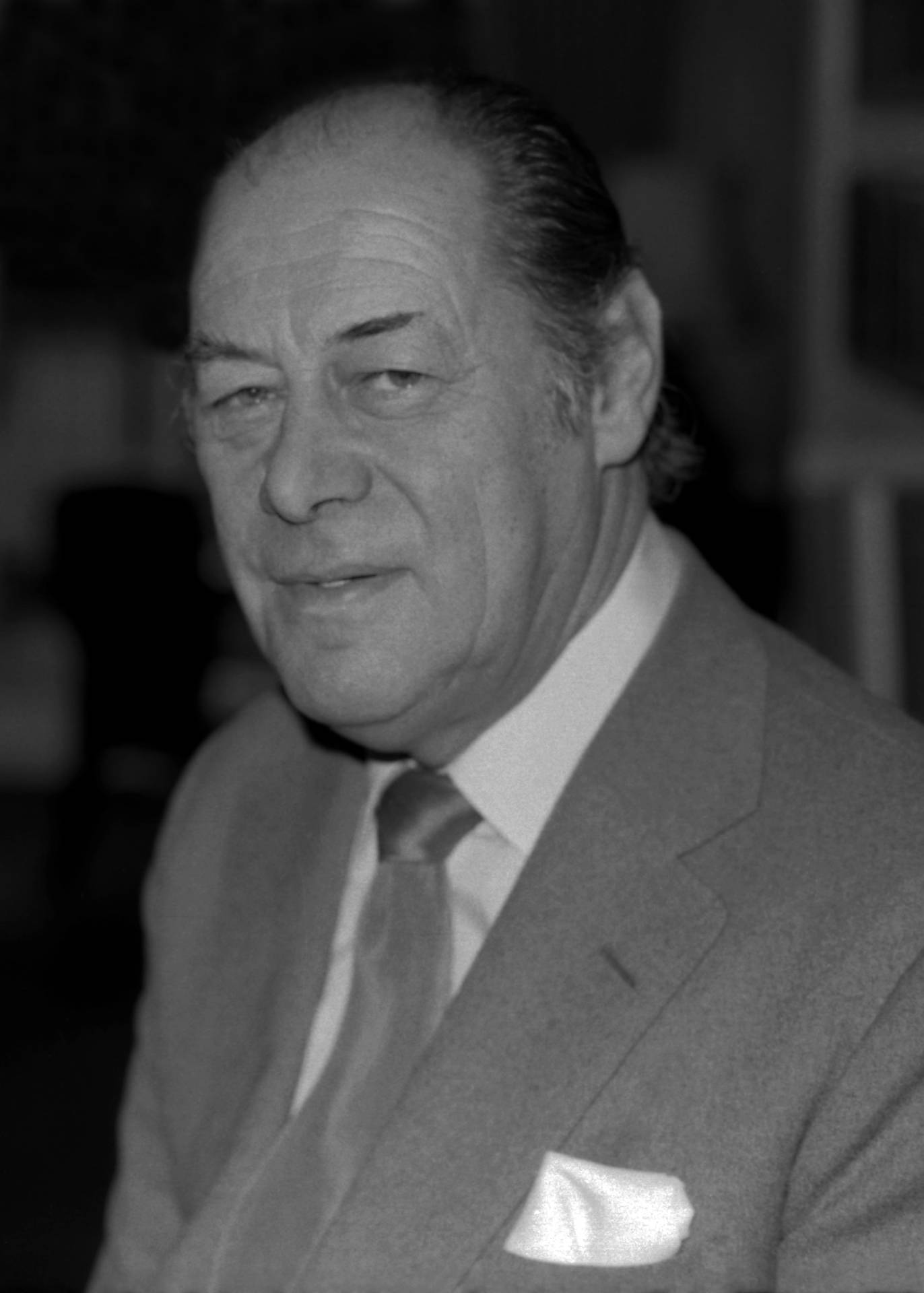 Elegant Portrait Of Rex Harrison Background