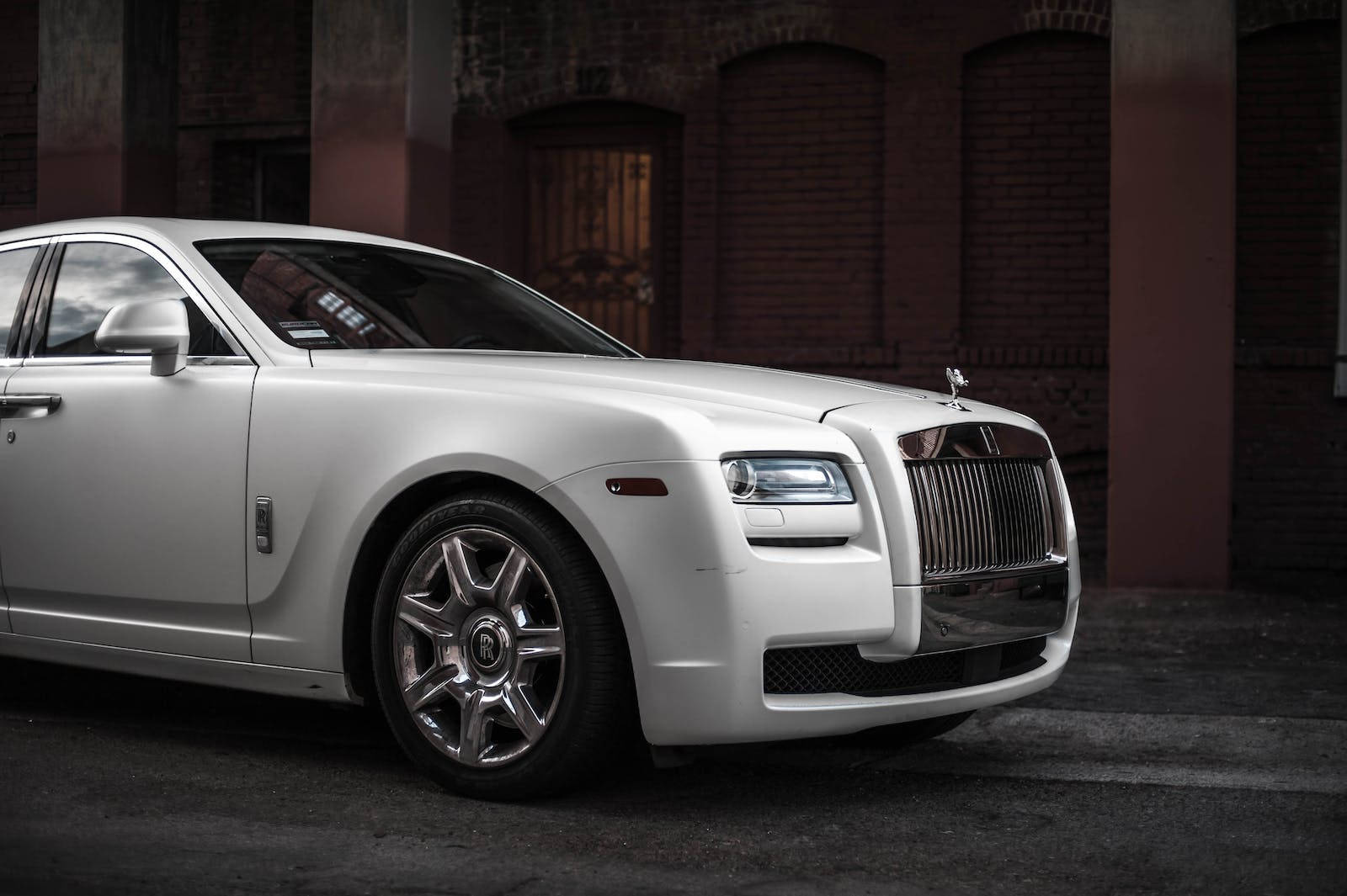 Elegant Sophistication - White Rolls-royce Ghost Luxury Car Background