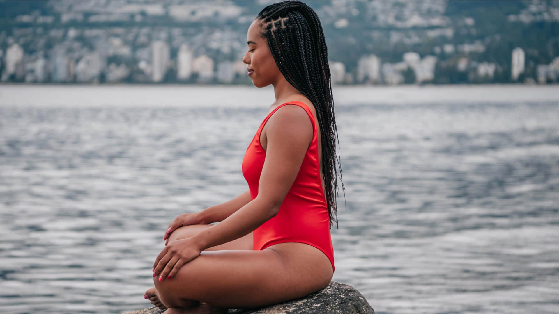 Elegant Swimsuit Model Meditating On The Beach Background