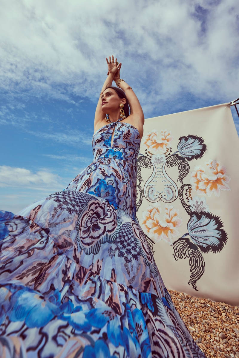 Elegant Temperley London Blue Dress With Arms Up Background