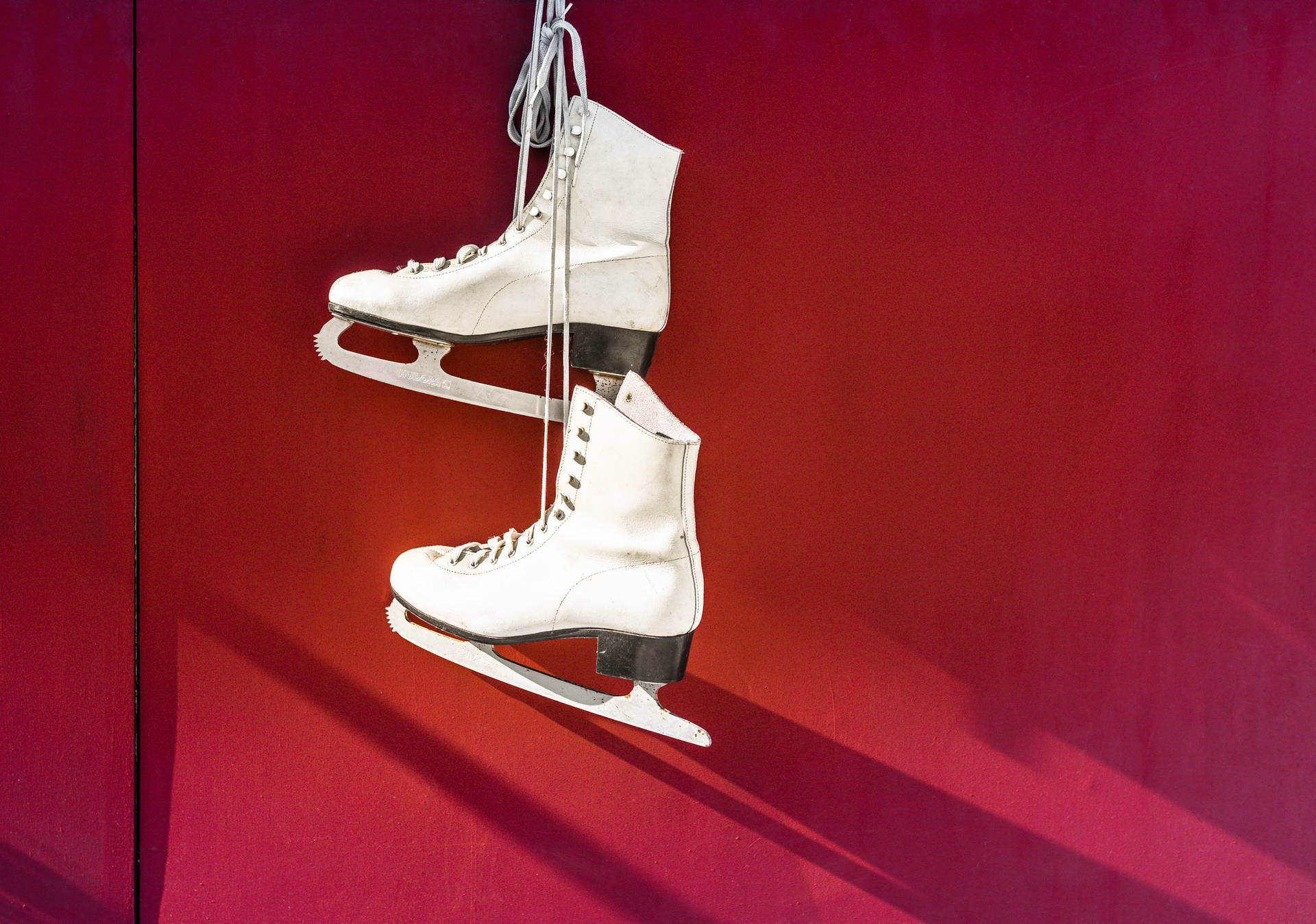Elegant White Ice Skating Shoes Background