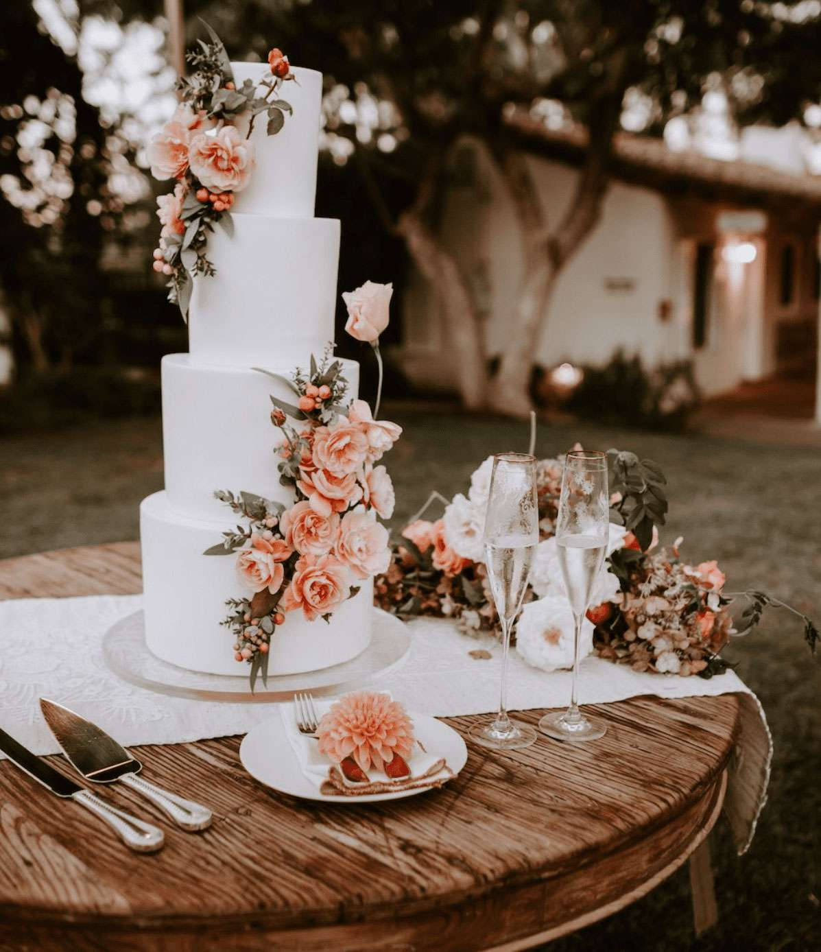 Elegant White Wedding Cake Adorned With Delicate Pink Roses