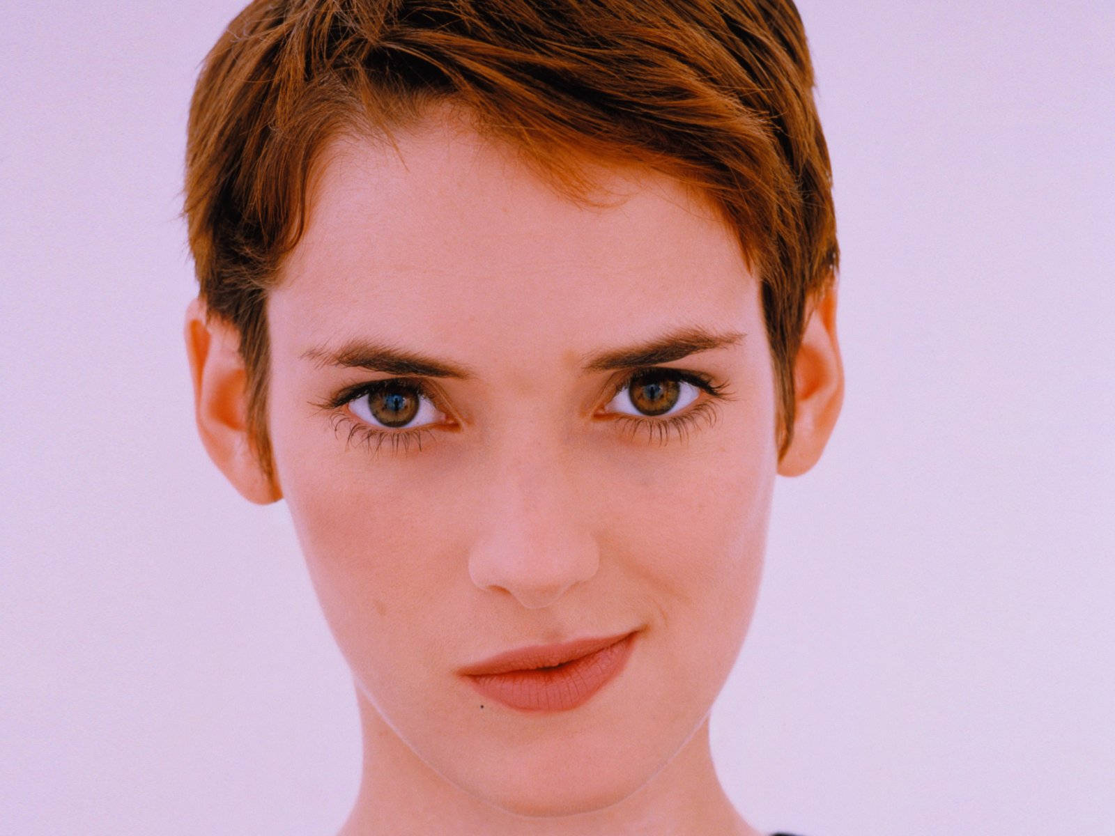 Elegant Winona Ryder Sporting A Chic Pixie Cut. Background