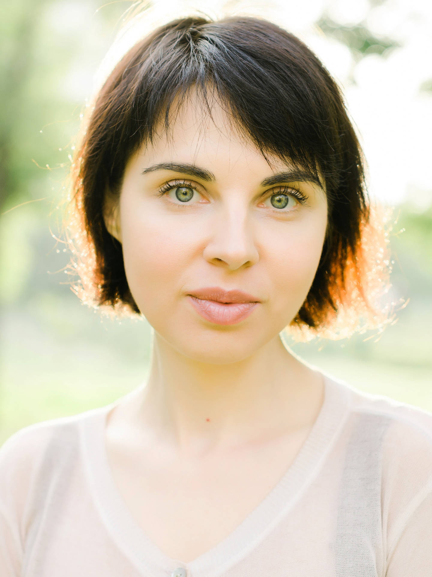 Elegant Woman In White Top Headshot Background