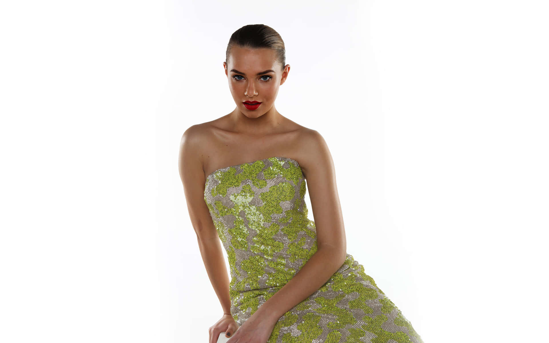 Elegant Womanin Green Sequined Dress Background