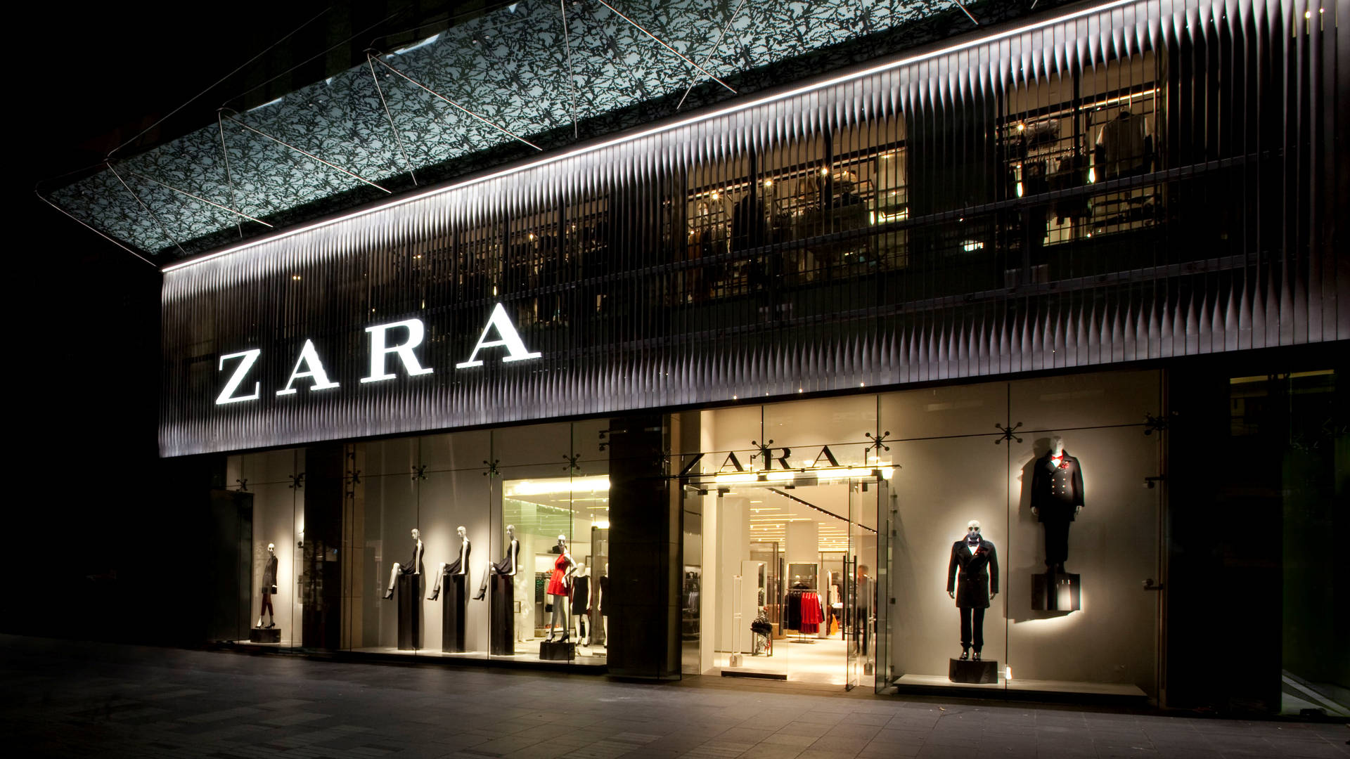 Elegant Zara Store At Night Background