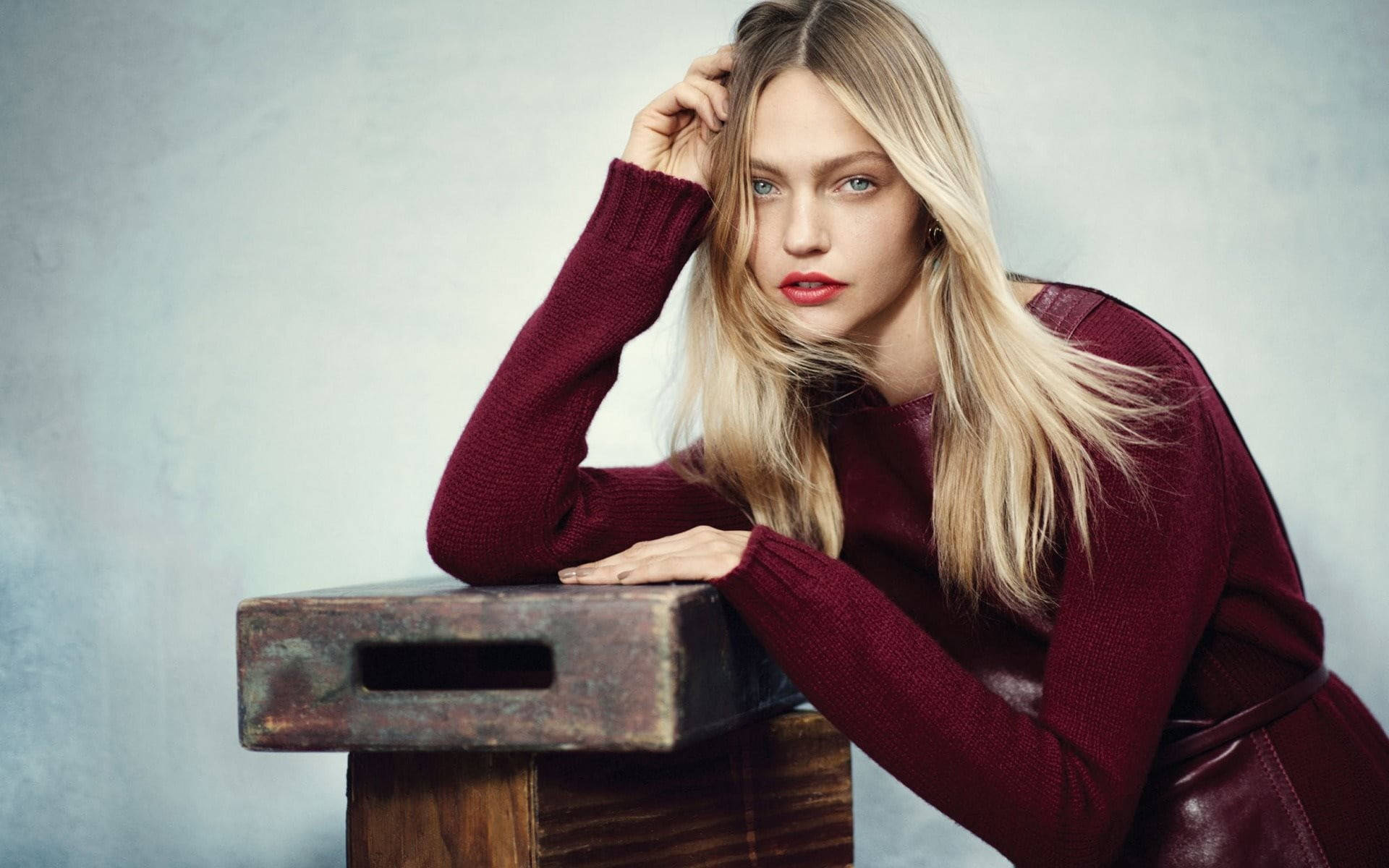 Elegantly Poised Russian Girl With Vintage Wood Boxes Background