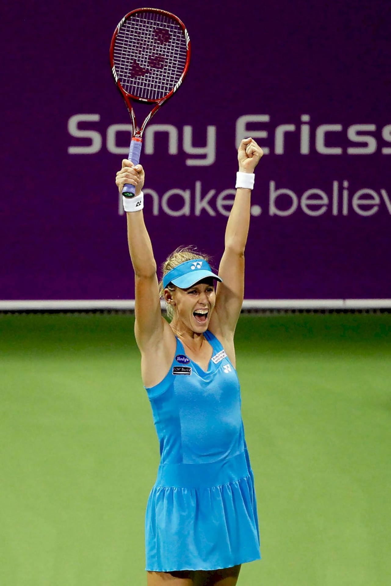 Elena Dementieva Celebrating Victory On Court Background