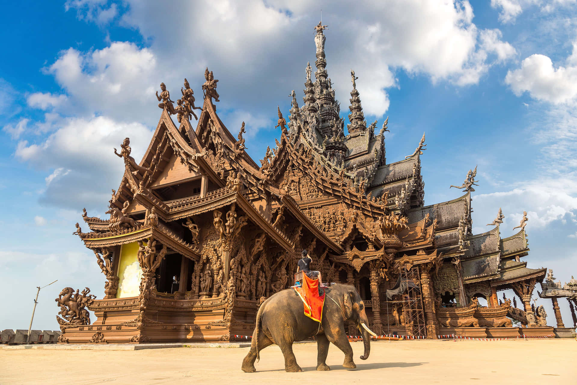 Elephant Walking Across The Sanctuary Of Truth Background