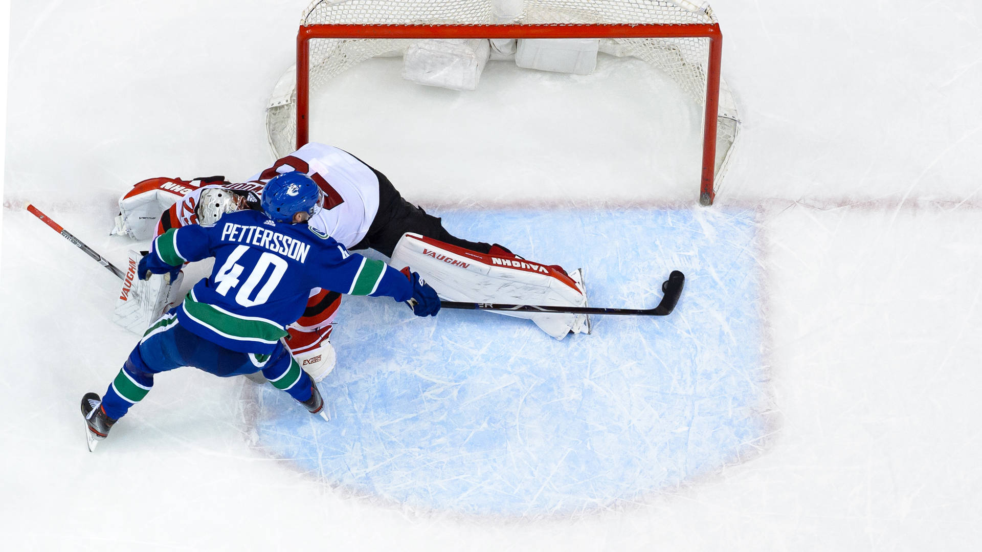 Elias Pettersson In Action Against Damon Severson