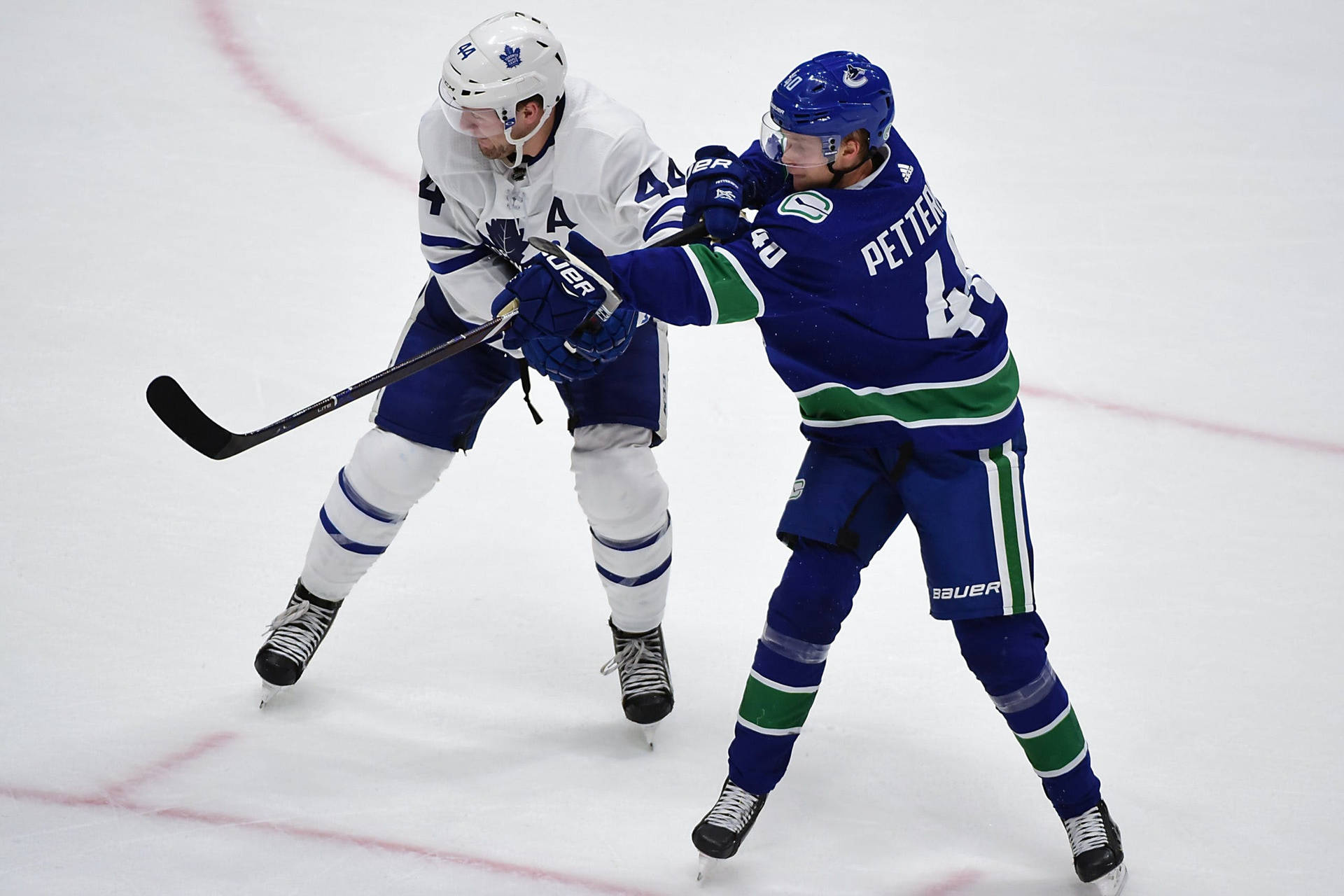 Elias Pettersson In Action Against Morgan Rielly