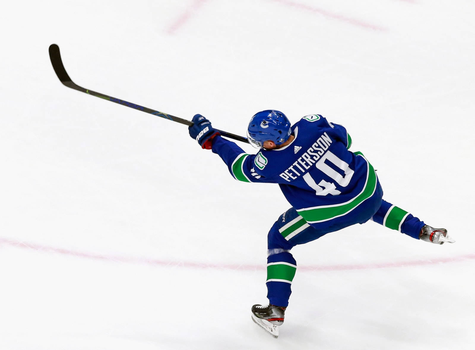 Elias Pettersson In Action During A Western Conference Game Background