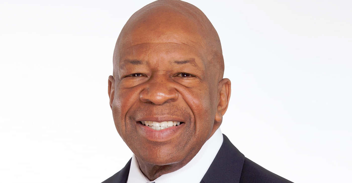 Elijah Cummings Smiling With Simple White Backdrop Background