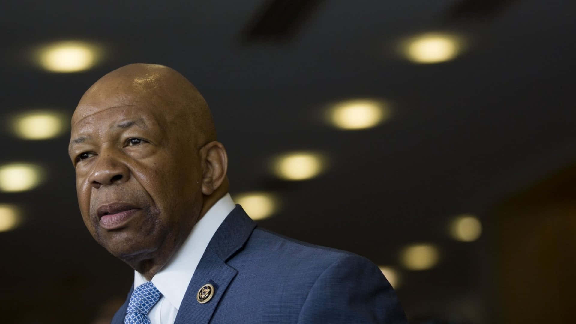 Elijah Cummings With A Black Backdrop With Lights Background