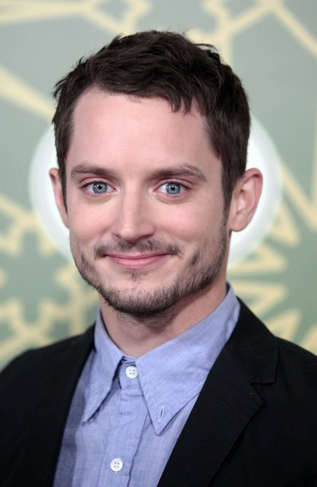 Elijah Wood Beaming Smile Background