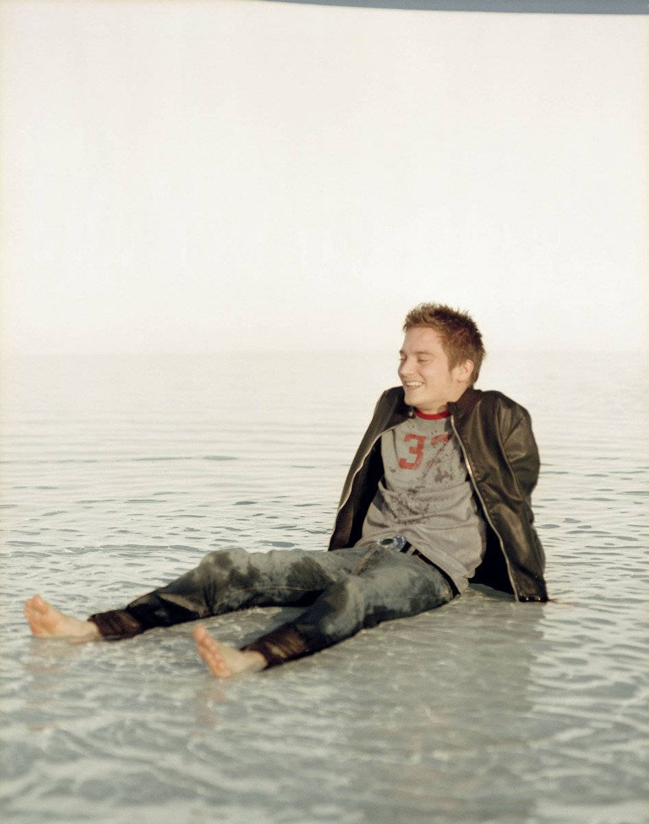 Elijah Wood On A Beach Background