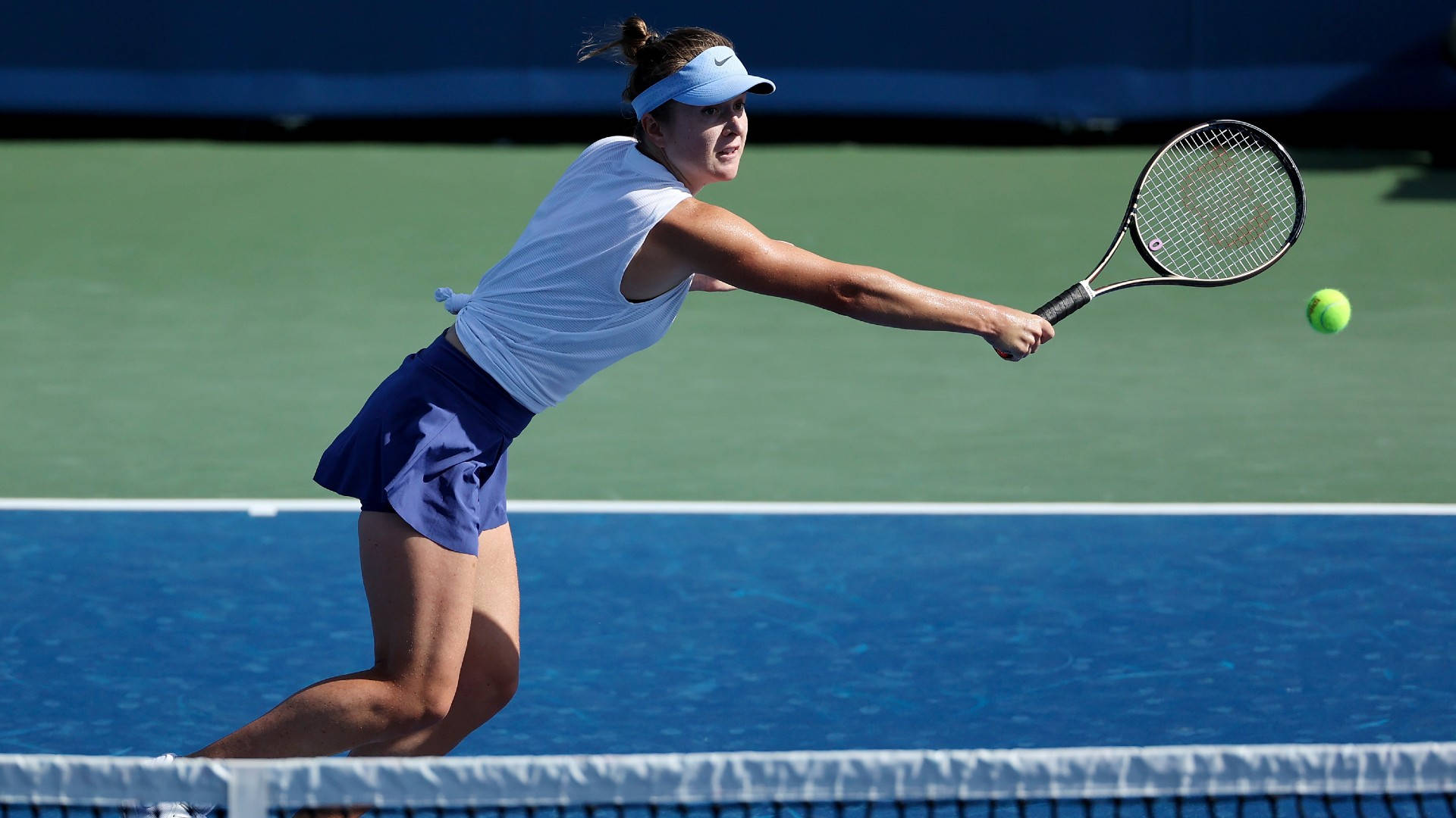 Elina Svitolina Diving To Receive Ball Background