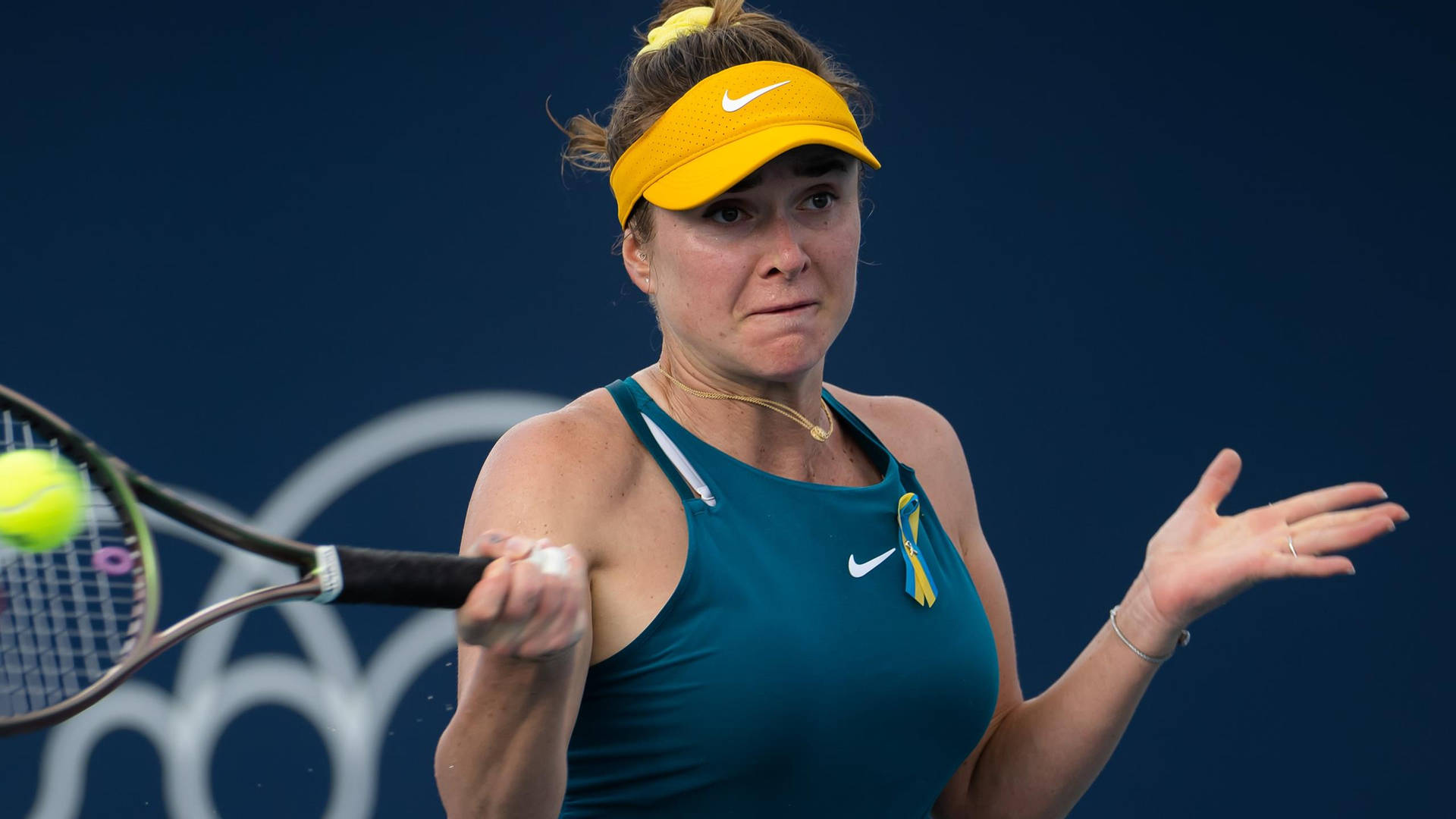 Elina Svitolina Hitting The Tennis Ball Background