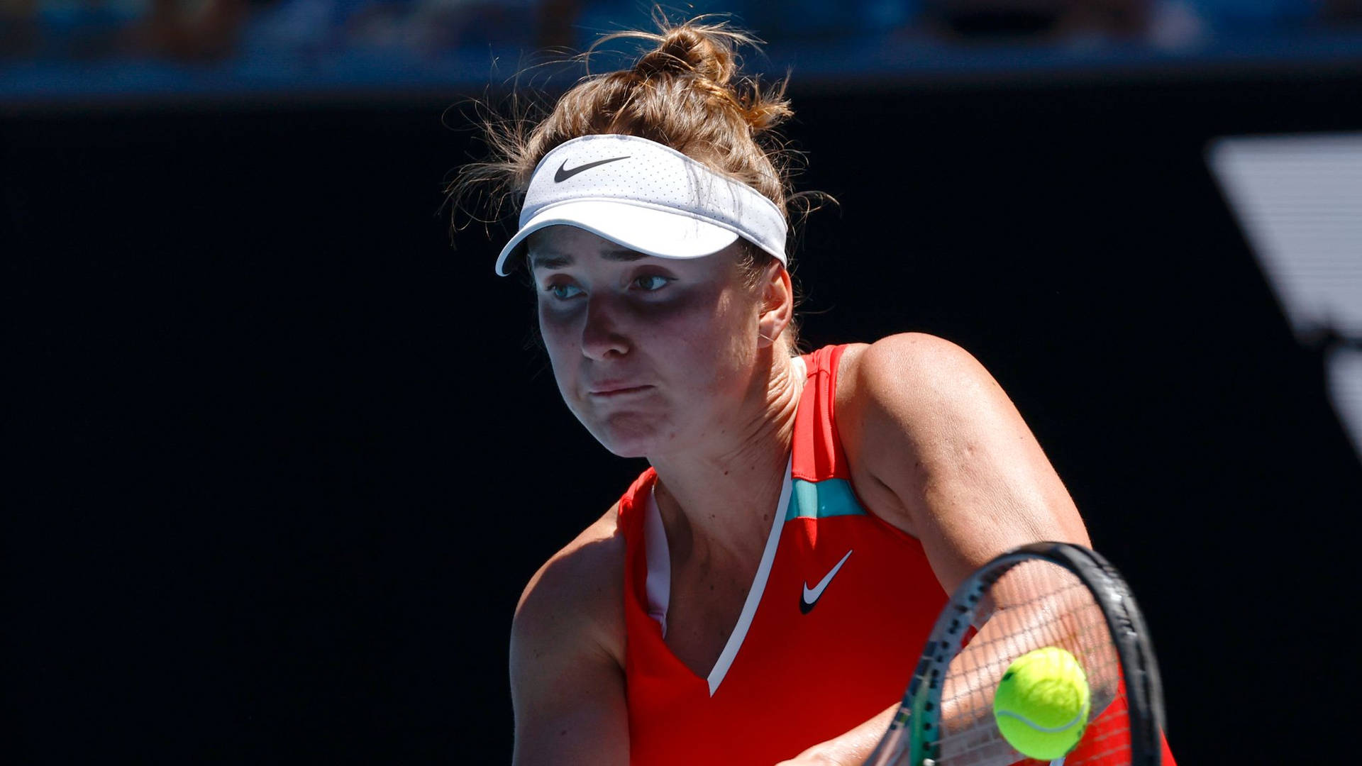 Elina Svitolina In Action, Elegantly Receiving The Ball During A Tennis Match.