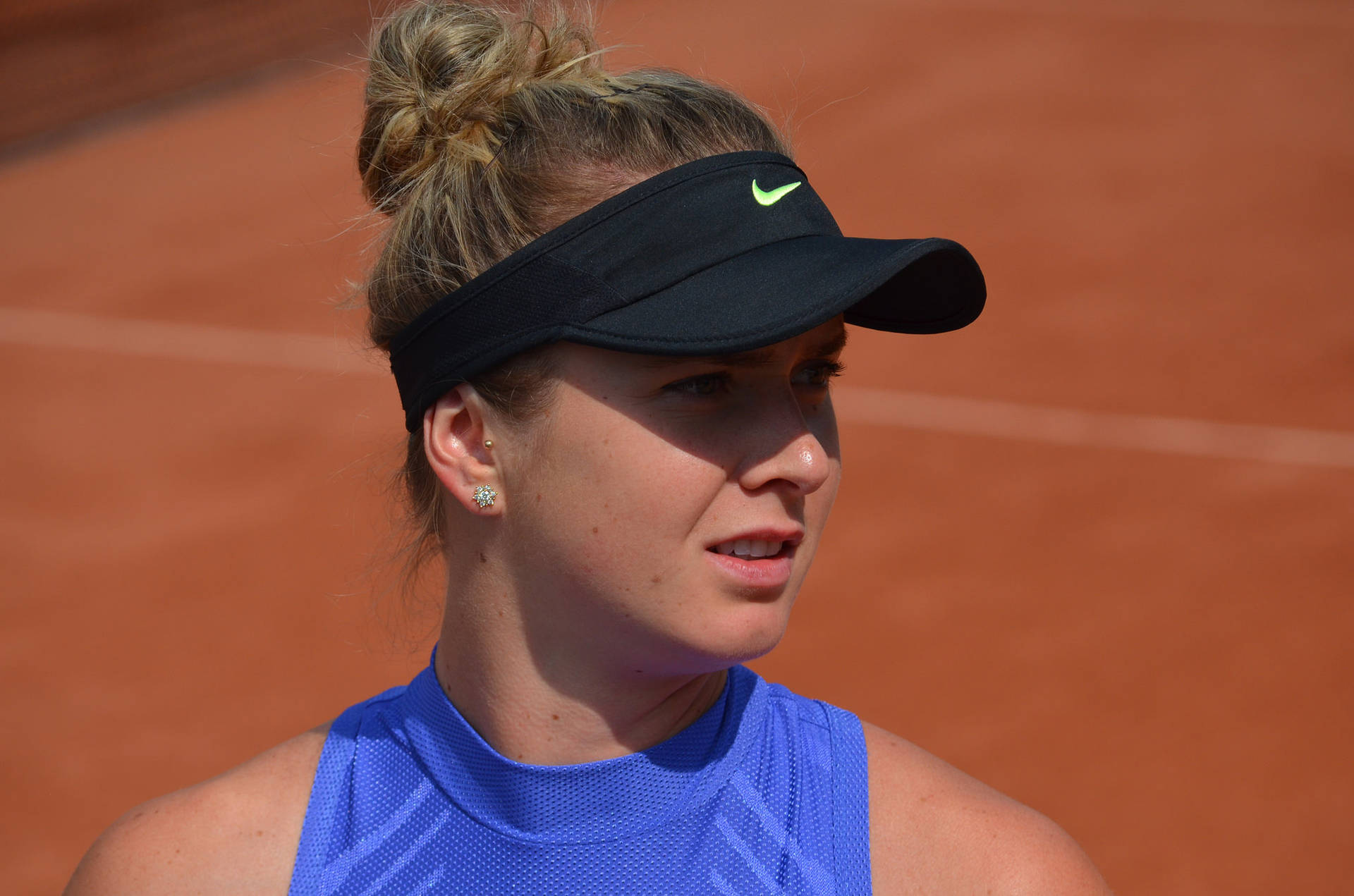 Elina Svitolina Shining Bright In Black Sun Visor Background