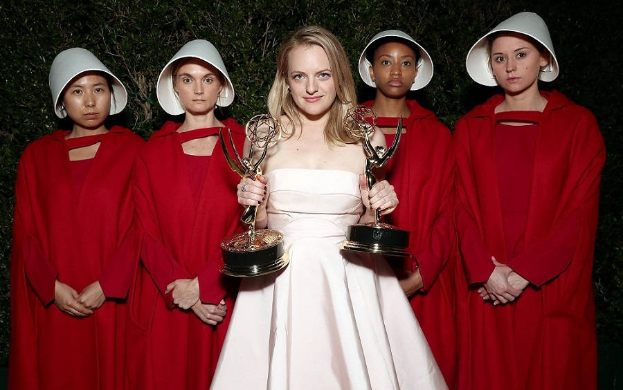 Elisabeth Moss Proudly Holding Her Emmy Award For Her Role In The Handmaid's Tale