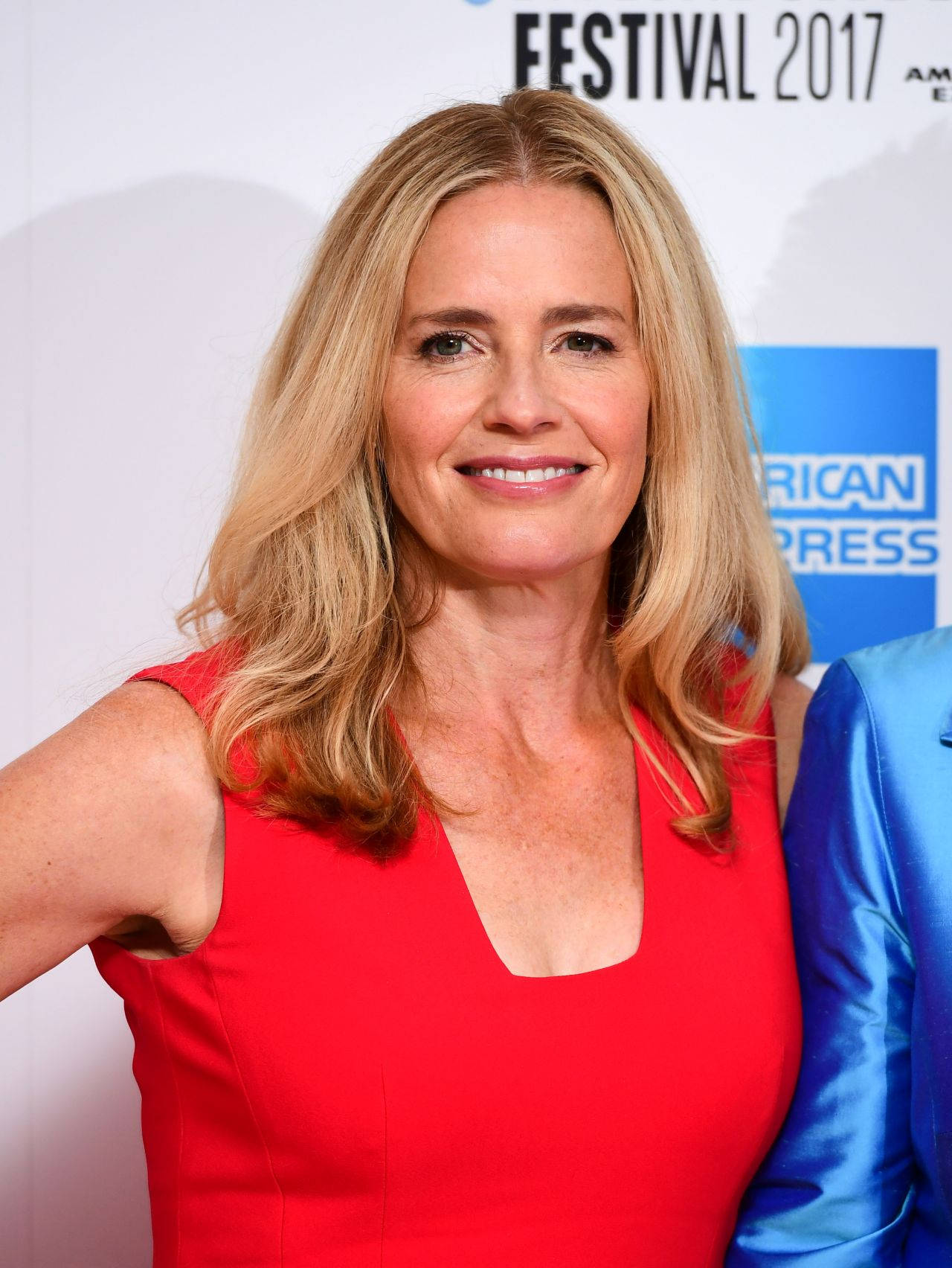 Elisabeth Shue Wearing A Red Dress Smiling During London Film Festival 2017 Background