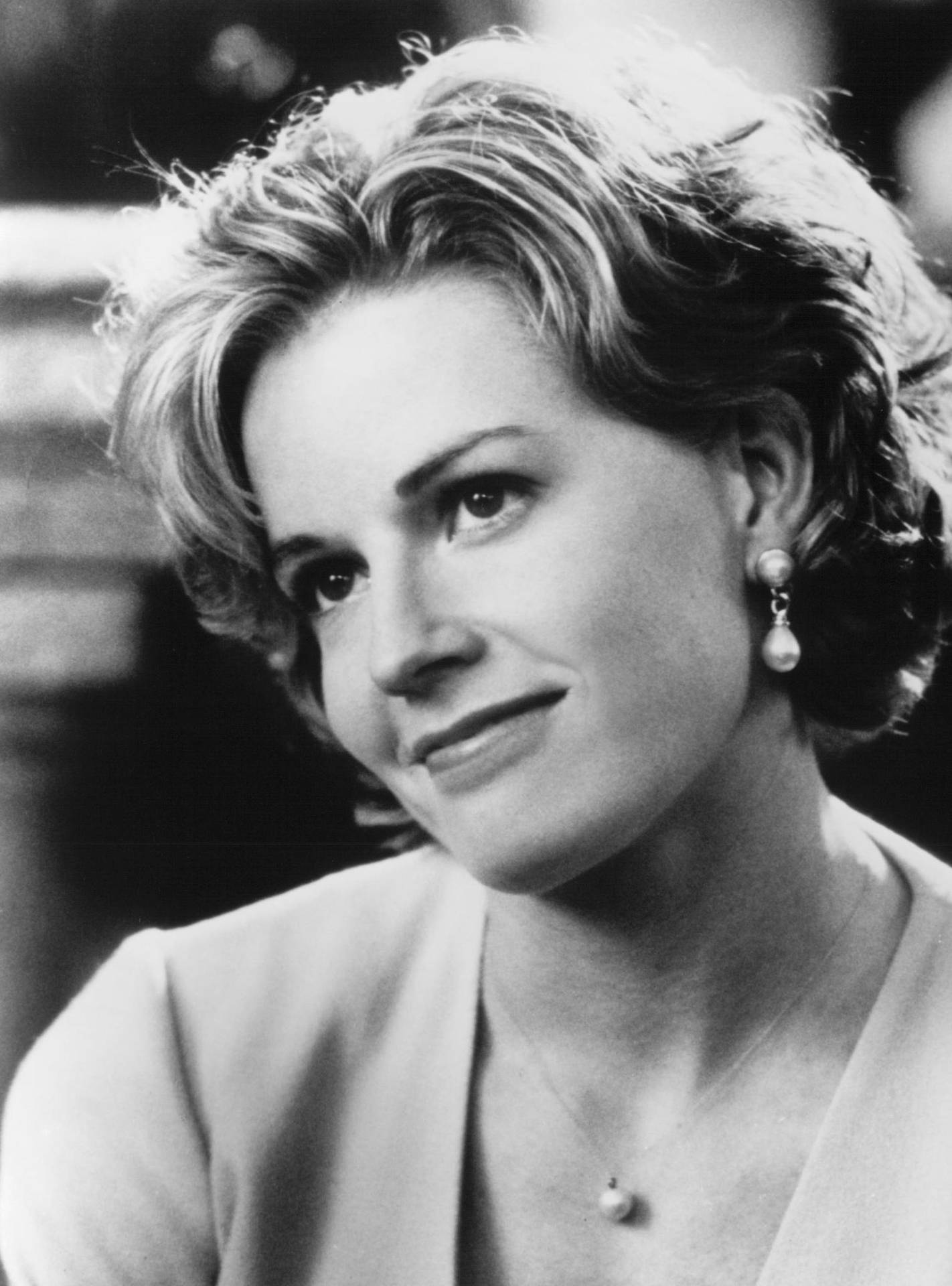 Elisabeth Shue With Short Bob Cut Hair Smiling In Black And White Effect Background