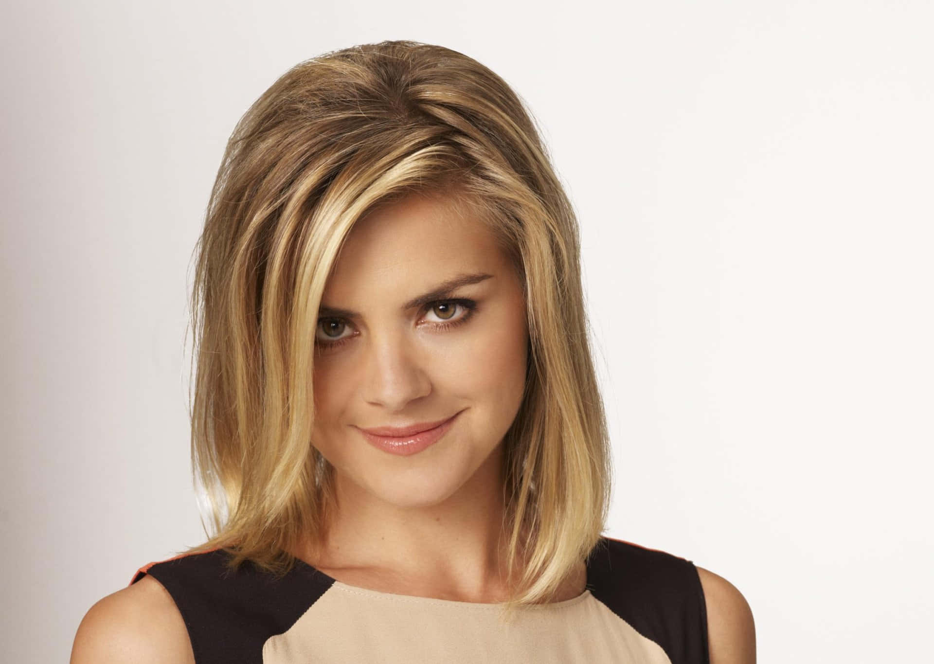 Eliza Coupe Radiating Confidence And Charm Background