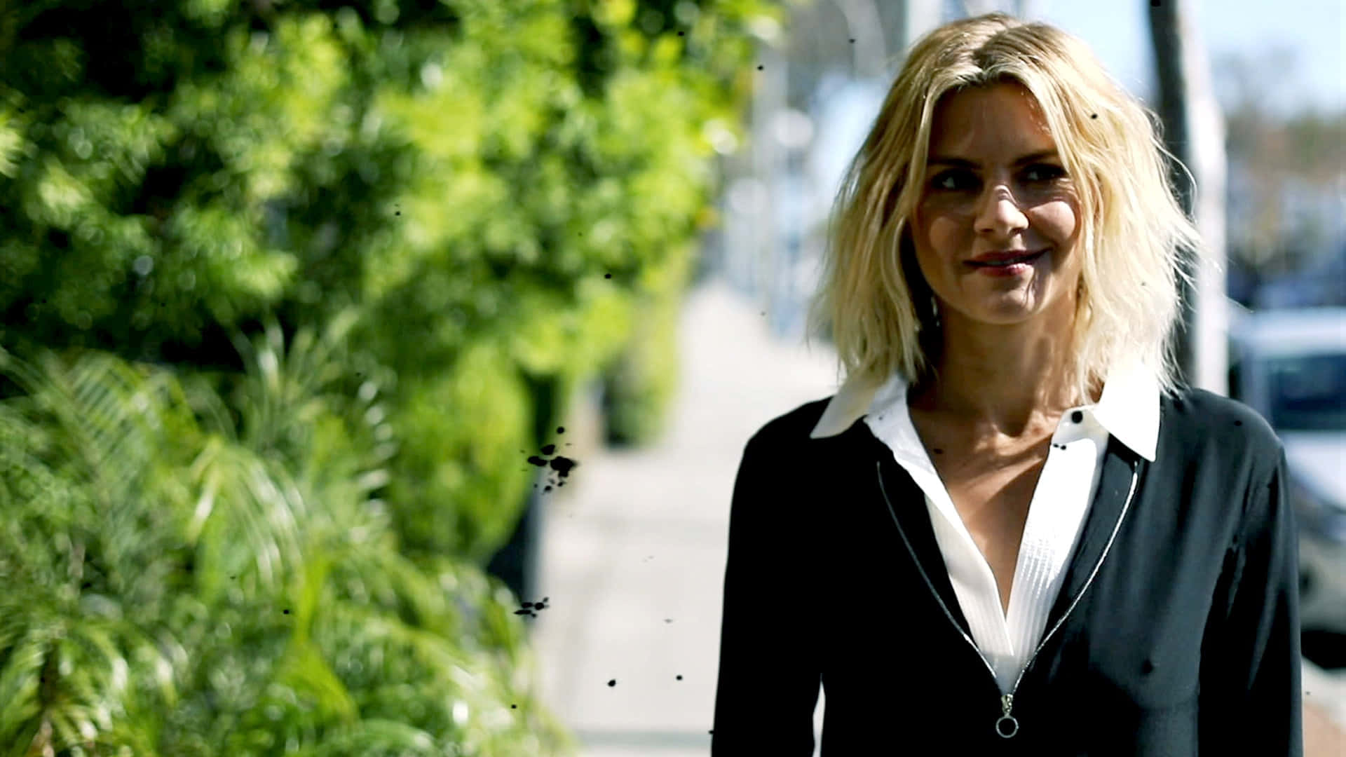 Eliza Coupe Striking A Pose In A Classy Outfit Background